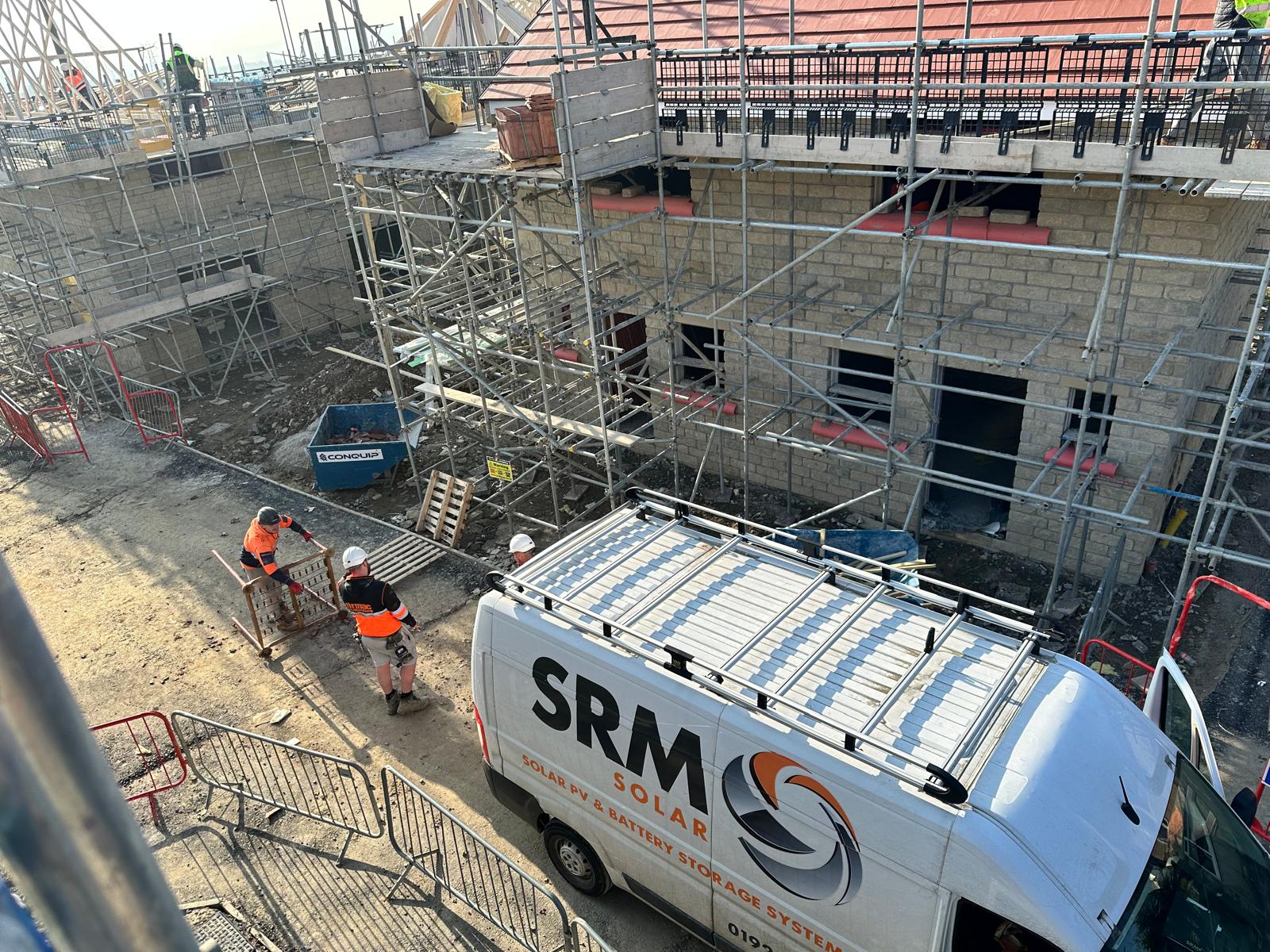 SRM Solar team working on a new build solar installation at a construction site